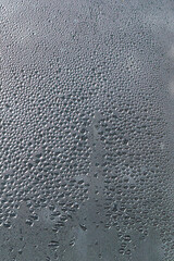 water drops on the window. water drops on glass. rain drops on glass surface. shape of water. texture of bubbles and wet condensation. Macro pattern. Closeup liquid. abstract droplets glass background