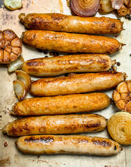 Fried sausages with garlic and onions.