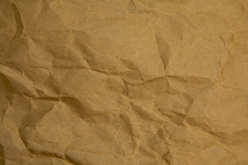 Brown wrinkle paper background texture. Brown template. Brown paper background.