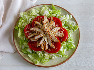 Healthy Homemade Sesame Salad with Chicken Tomato and Chinese cabbage. Top view flat lay