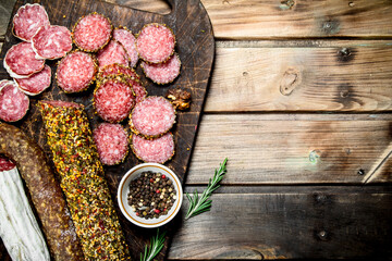 Different kinds of salami on cutting Board.