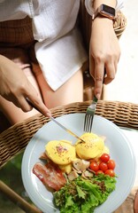 Breakfast Eggs Benedict toasted English muffins. Delicious breakfast with eggs Benedict