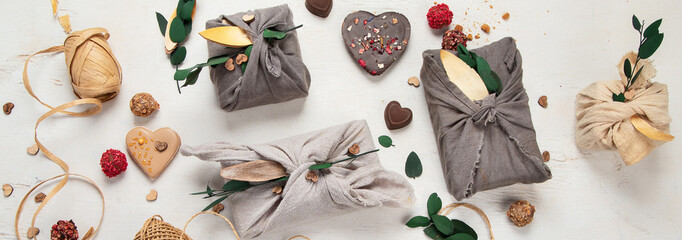 Valentine's Day Zero Waste Concept. Eco-friendly linen packaging as a gift for Valentine's Day in furoshiki style. Simple eco presents plastic free.