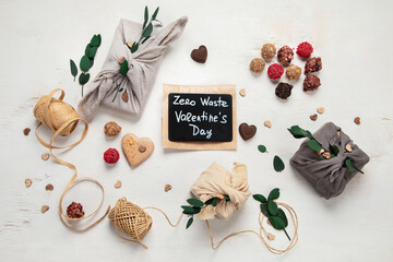 Valentine's Day Zero Waste Concept. Eco-friendly linen packaging as a gift for Valentine's Day in furoshiki style. Simple eco presents plastic free.