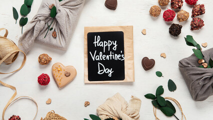 Valentine's Day Zero Waste Concept. Eco-friendly linen packaging as a gift for Valentine's Day in furoshiki style. Simple eco presents plastic free.