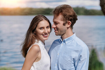 Obraz premium young couple kisses during a country walk .
