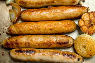 Fried sausages with garlic and onions.