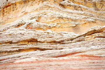 Fototapeta na wymiar Mindblowing shapes and colors of moonlike sandstone formations in White Pocket, Arizona, USA.
