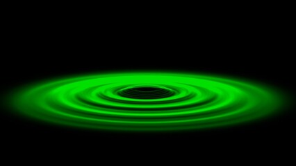 黒い背景に緑色の光の波紋