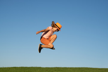 Sporty child boy runner running in summer park. Active kids, sport children.