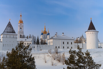 Ancient Tobolsk Kremlin with golden-domed churches and triangular turrets in winter, Siberia, Russia.