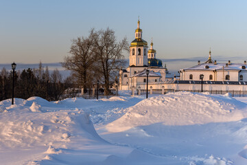 Ancient white-stone churches of the Abalaksky monastery in winter, Siberia, Russia.