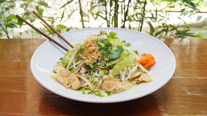 Spicy chicken meat salad with vegetables. Traditional asian recipe.
