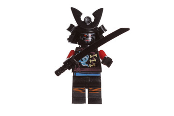 Naklejka premium Russia Vyborg 01.14.2023 Lego samurai figurine in armor and a helmet with a katana in his hand isolated on a white background