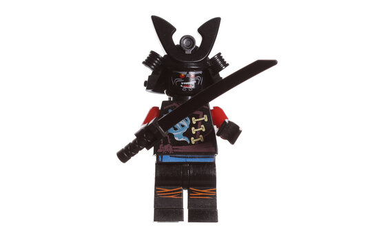 Russia Vyborg 01.14.2023 Lego samurai figurine in armor and a helmet with a katana in his hand isolated on a white background