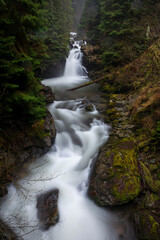 Sucu waterfall flowing through rocks in a deep forest - 562027432