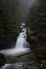 Sucu waterfall flowing through rocks in a deep forest - 562027458
