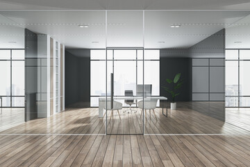 Front view on sunlit office minimalistic style interior design with workspace, green plant, dark walls and city view background from panoramic window behind transparent partitions. 3D rendering