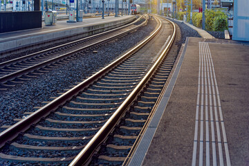 Empty platform with S-Bahn train line S6 destination Baden arriving at railway station Zürich...