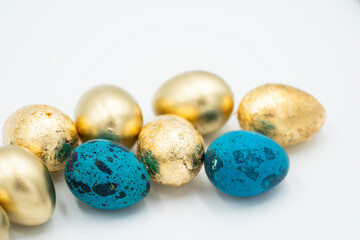 Easter golden and black eggs, feather.
