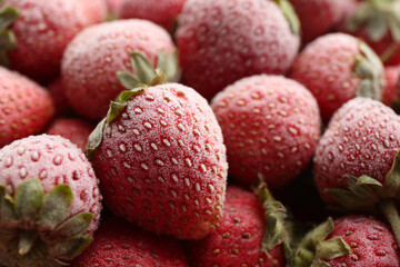 Tasty frozen strawberries as background, closeup view