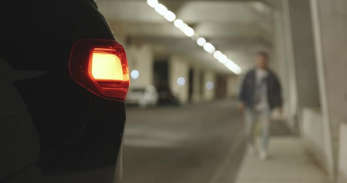 Man is picked up by a black suv