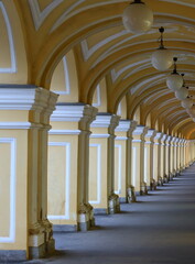 Fototapeta premium Yellow arched Colonnade of the Old Gostiny Dvor, Dumskaya Street, St. Petersburg, Russia, January 2023