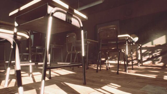 View to classroom with tables and small blackboard and grungy walls