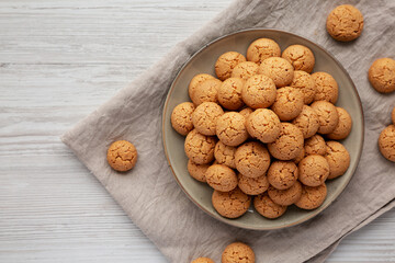 Homemade Italian Amaretti Cookie Biscuits on a Plate, top view. From above, overhead, flat lay. Copy space.