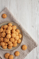 Homemade Italian Amaretti Cookie Biscuits on a Plate, top view. From above, overhead, flat lay. Copy space.