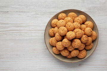 Homemade Italian Amaretti Cookie Biscuits on a Plate, top view. From above, overhead, flat lay. Space for text.