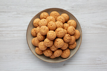Homemade Italian Amaretti Cookie Biscuits on a Plate, top view. From above, overhead, flat lay.