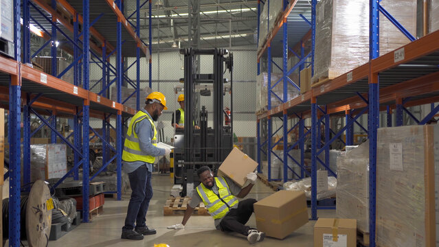 A worker got accident in large warehouse retail store industry. Rack of stock storage. Interior of cargo in ecommerce and logistic concept. Depot. People lifestyle. Shipment service. Safety.