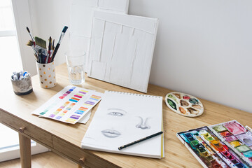 Art Desk with Sketches Paintings and Brush Colorful Creative Creativity