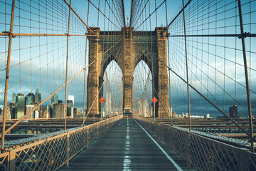 On the famous Brooklyn Bridge in the morning