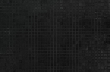 Dark black ceramic wall chequered and floor tiles mosaic background in bathroom. Design pattern geometric with grid wallpaper texture decoration pool. Simple seamless abstract surface grunge.