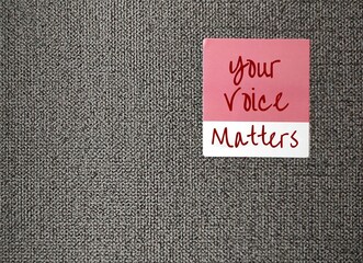 Pink sticker on wallpaper with text written YOUR VOICE MATTERS, concept of expressing one internal...