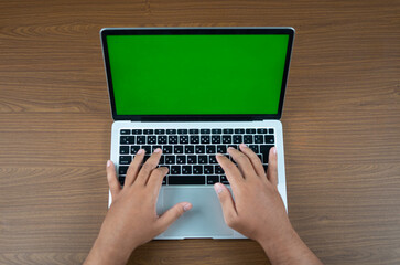 Hands typing on a blank laptop screen