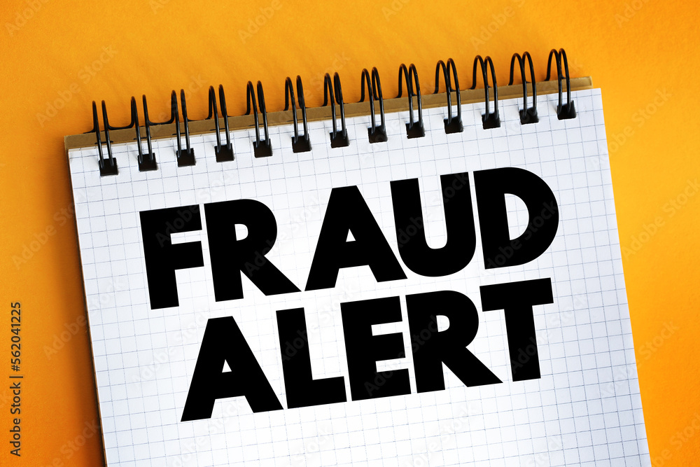 Poster fraud alert text on notepad, concept background