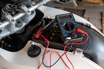 check if the motorcycle battery with multimeter