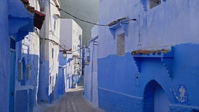 Blue city of Chefchaouen in the kingdom of Morocco. Narrow streets with fascinating ancient architecture, the walls of the houses are painted in various shades of blue and blue.