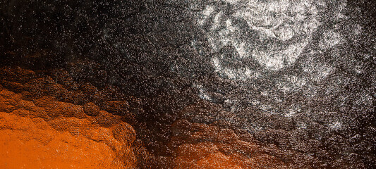 Abstrakt black-white-orange background,dramatic night sky with stars,light reflections on a glass...