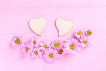 Chrysanthemum flower with heart shape on pink background, Love Valentine concept