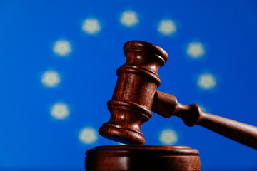 Flag of European Union and wooden judge gavel. Law concept