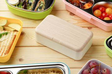 Containers with healthy food on wooden background top view.