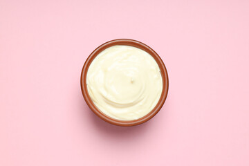 Concept of egg sauce, mayonnaise on pink background