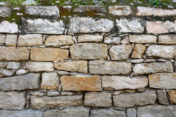 Texture of old rough natural brick stone wall  
