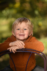 blond child playing outside