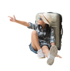 Happy kid Travel Concept, Full body Pretty asian little girl hand pointing and sits on a suitcase...