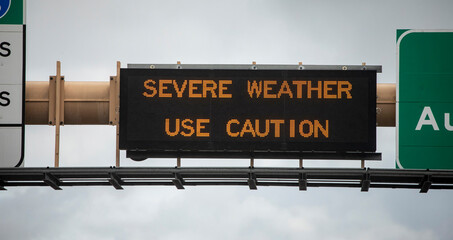 Digital sign at freeway stating Severe Weather Use Caution .  The image is from the 15 freeway in...